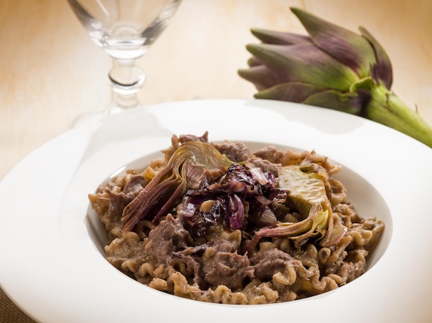 Integral pasta with artichoke and chicory vegetarian food