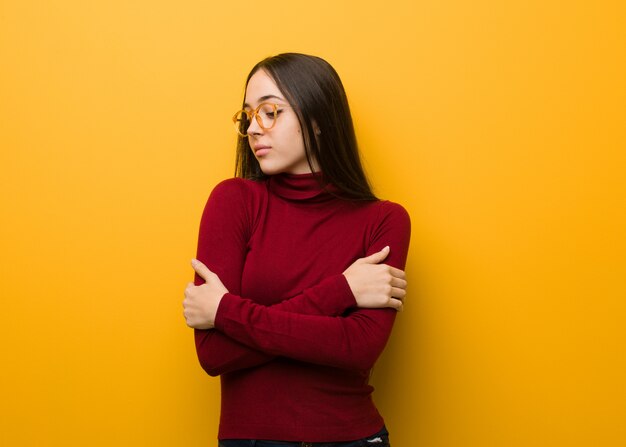 Intellectual young girl giving a hug