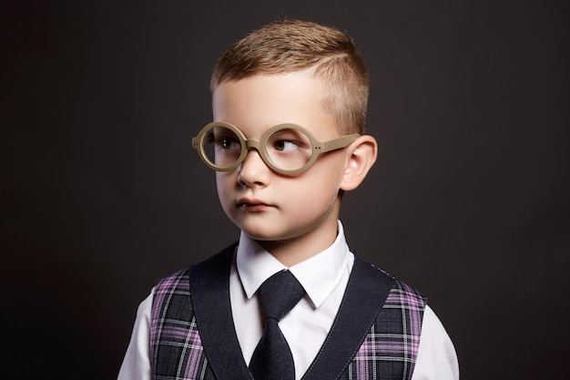 Intelligent child in glasseselegant kid