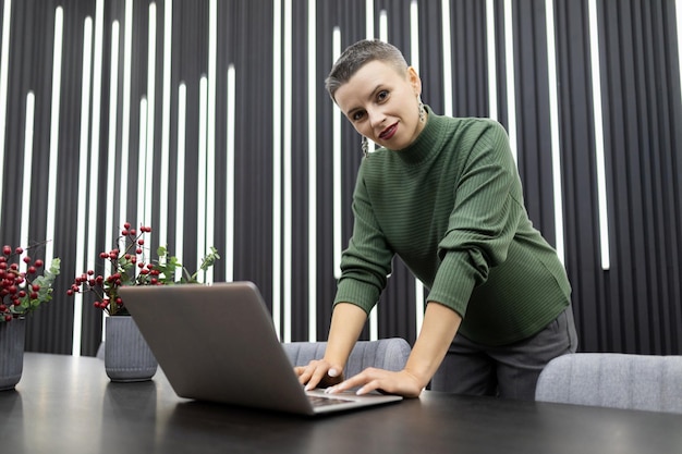 Intelligent professional employee woman working on a project while sitting in the office