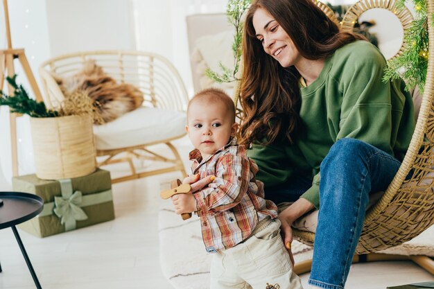 Interaction between an active toddler and a young mother at home spending time together