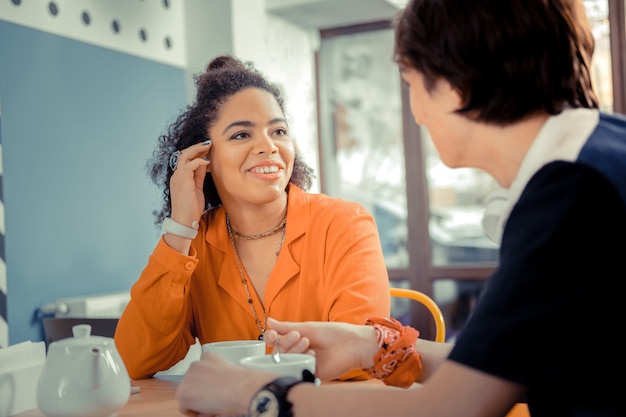 An interesting conversation. The girl talking to her partner during the date in a cafe