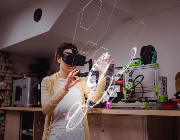 Photo interface against female graphic designer using the virtual reality headset