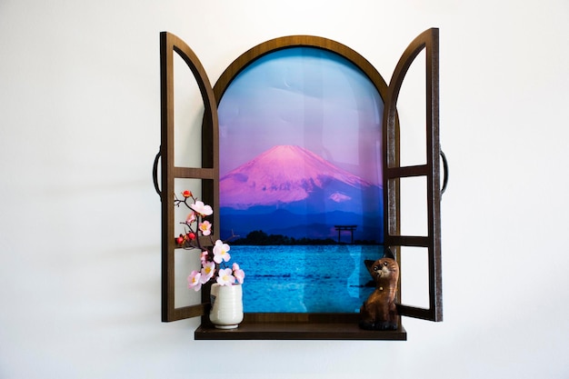 Interieur decoratie meubels en raam uitzicht landschap Fuji berg met figuur kat en sakura bloementak in keramische vaas in huis huis woonkamer voor thaise mensen rust ontspannen in Bangkok Thailand