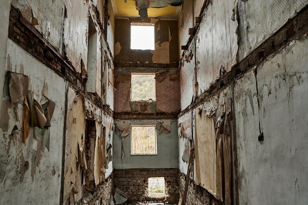 The interior of an abandoned crumbling building a dying city\
frightening atmosphere