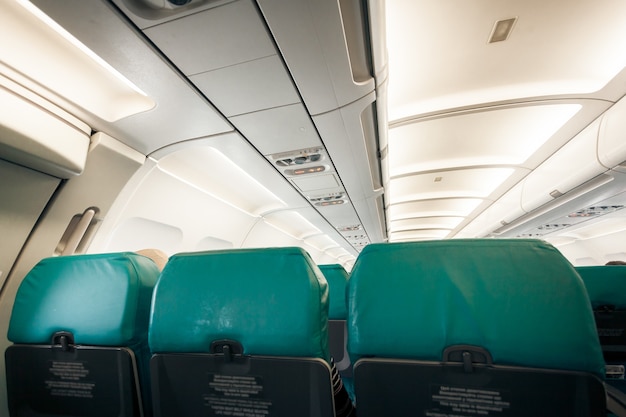 Interior of airplane with row of seats