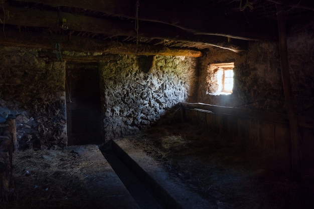 Interior of an ancient rural stable in northern Italy