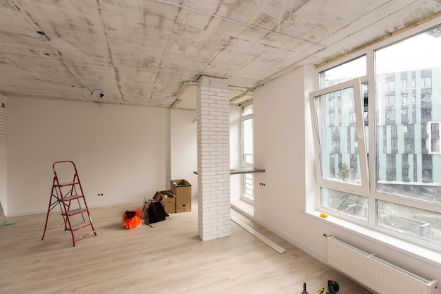 Interior of apartment with materials during on the renovation and construction, remodel wall from gypsum plasterboard or drywall