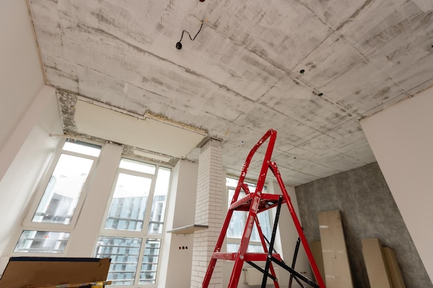 Interior of apartment with materials during on the renovation and construction, remodel wall from gypsum plasterboard or drywall