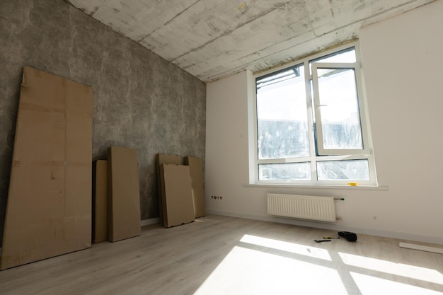 Interior of apartment with materials during on the renovation and construction, remodel wall from gypsum plasterboard or drywall