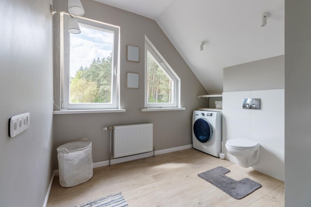 Interior of bathroom with modern washing machine