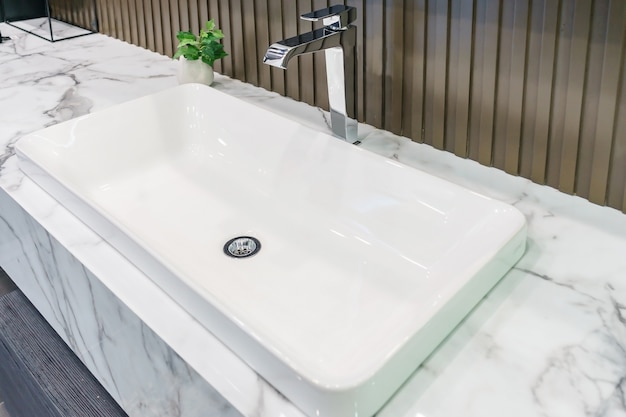 Interior of bathroom with sink basin faucet and mirror. Modern design of bathroom