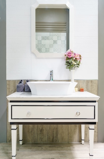 Interior of bathroom with sink basin faucet and mirror. Modern design of bathroom