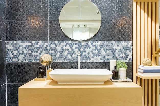 Photo interior of bathroom with sink basin faucet and mirror.