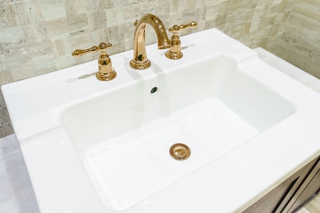 Interior of bathroom with sink basin faucet and mirror