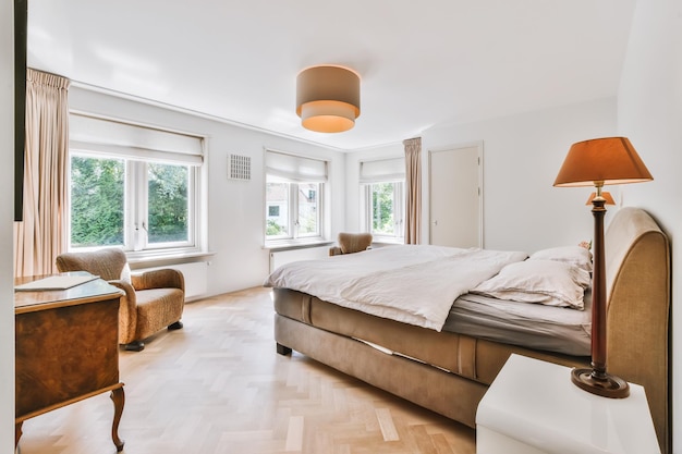 The interior of a beautiful bedroom with a soft double bed