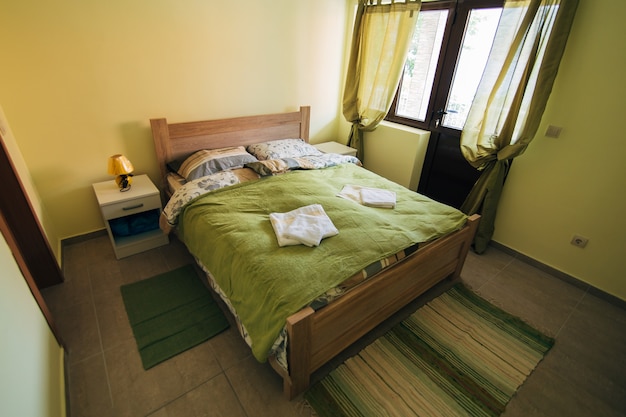 Interior of the bedroom in green colors