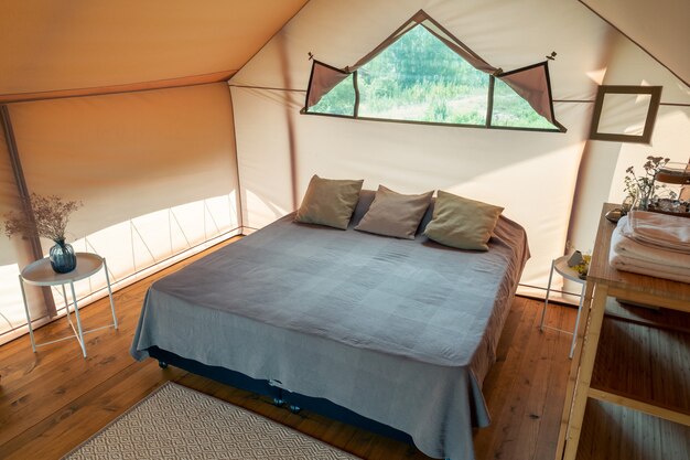 Interior of bedroom inside glamping house