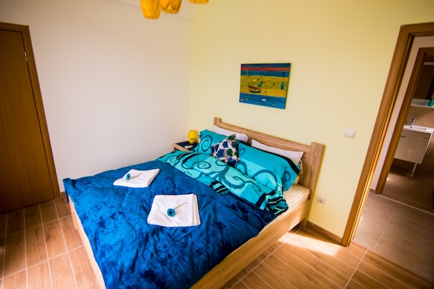 Interior of the bedroom in white and green colors