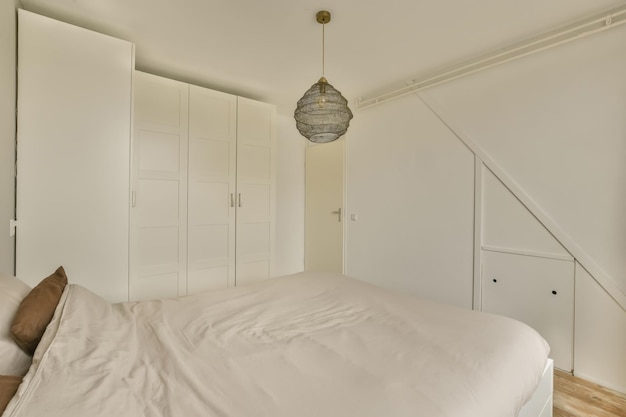 The interior of a bedroom with a large wardrobe