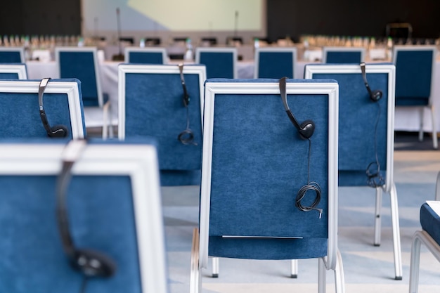 Photo interior of big modern conference room before starting a business seminar