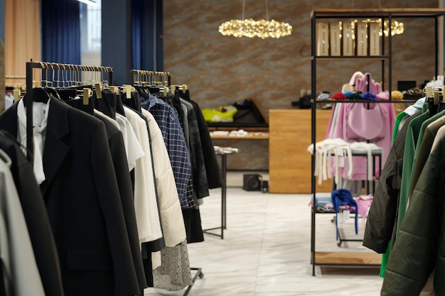 Photo interior of boutique or showroom with new seasonal fashion collection