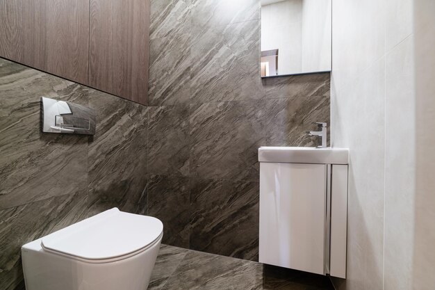 interior of a bright toilet with a washbasin in the house