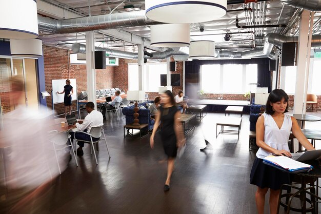 interior of busy design office with staff
