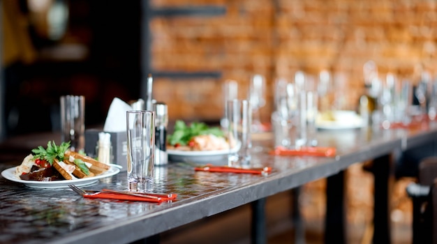 interior of the cafe, in the evening in brown tones, with dishes and furniture. High quality photo