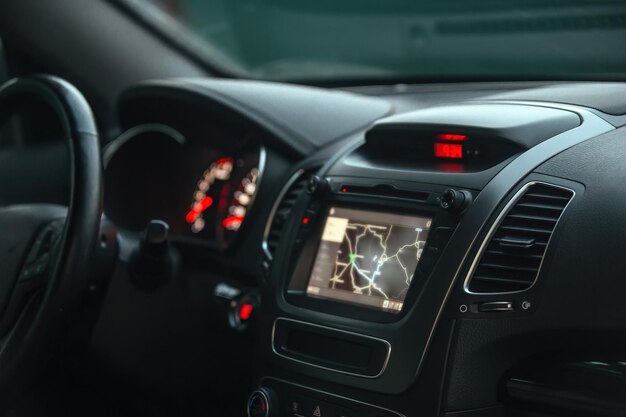 the interior of the car its dashboard and onboard computer display with the included navigator