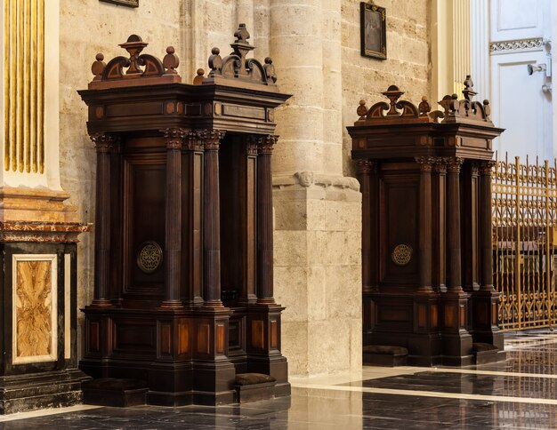 Interior of catholic church: confessional detail, 150 years old, made of wood