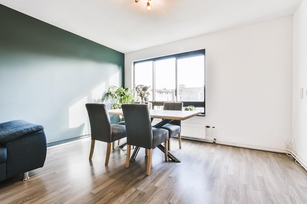 The interior of a charming dining room with a wooden table