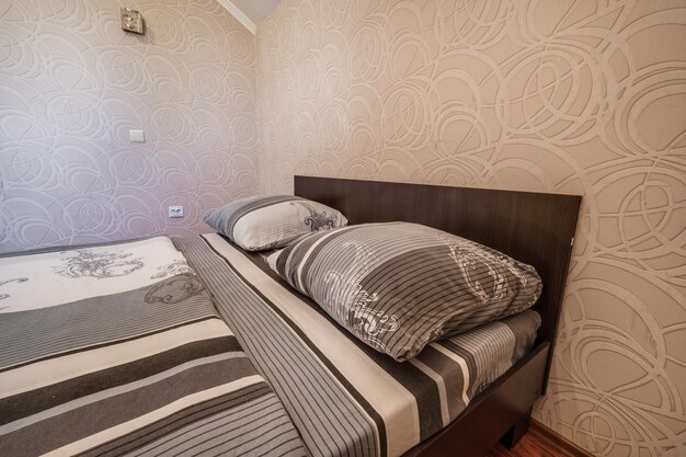 Interior of cheapest bedroom in studio apartments or hostel