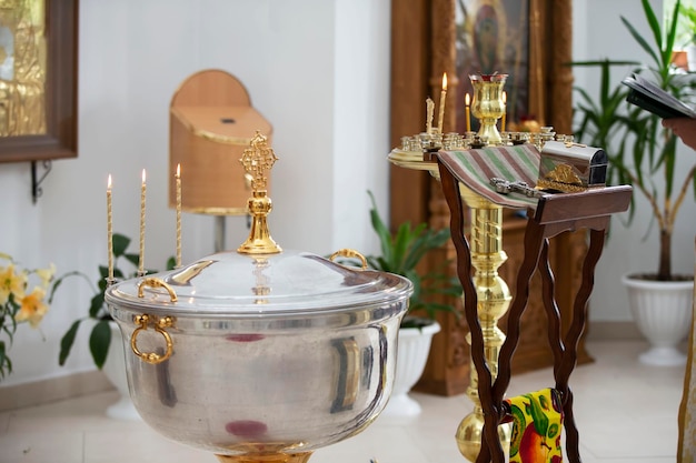 The interior of the church during the baptism of a child Bath for baptism