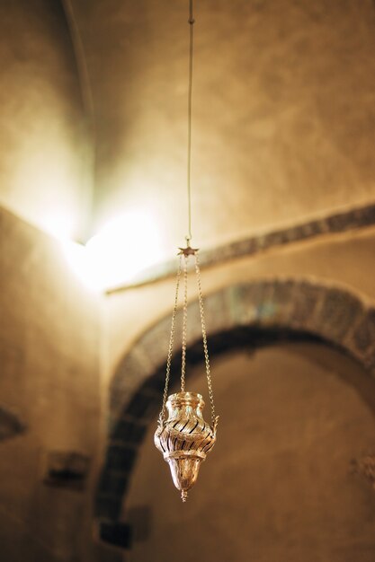 The interior of the church icons chandelier candles in a small church