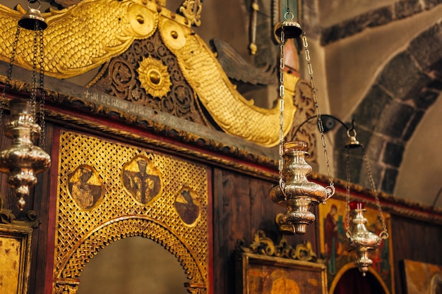 The interior of the church icons chandelier candles in a small church