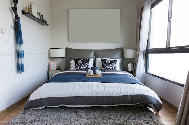 Interior of  comfortable bedroom with white wall