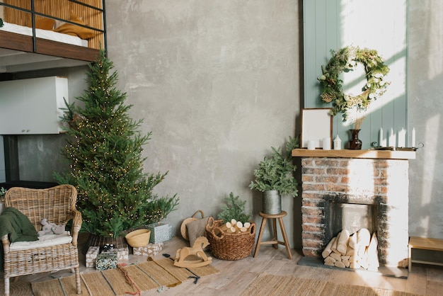 Interior of a country house with a fireplace a Christmas tree a wicker chair and decor for the new Year