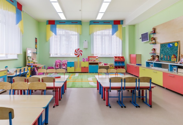 the interior of cozy large room for classes and games in kindergarten.