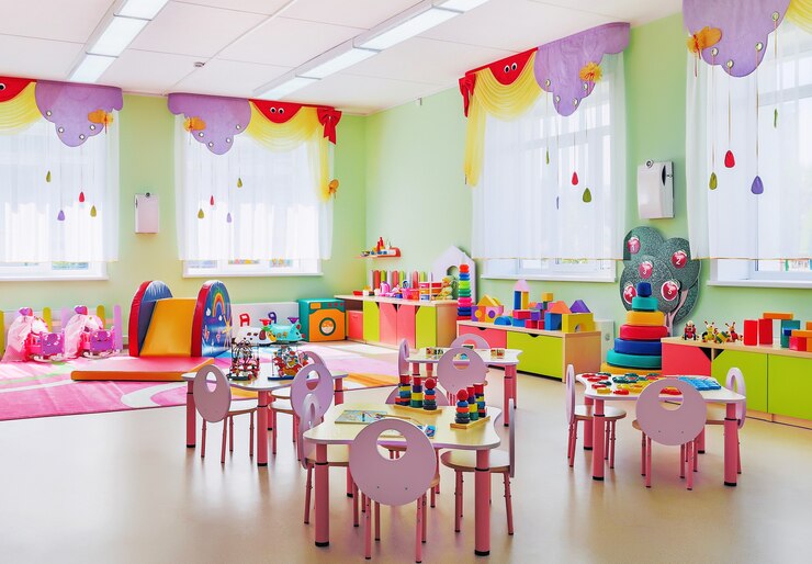 Interior of cozy pink playroom in kindergarten.