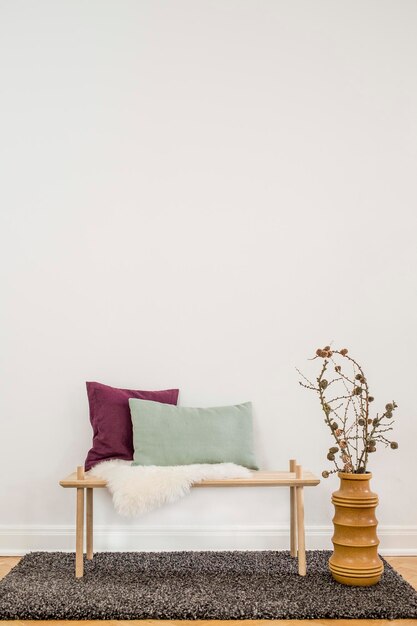 Interior decor of a hallway with a bench and vase