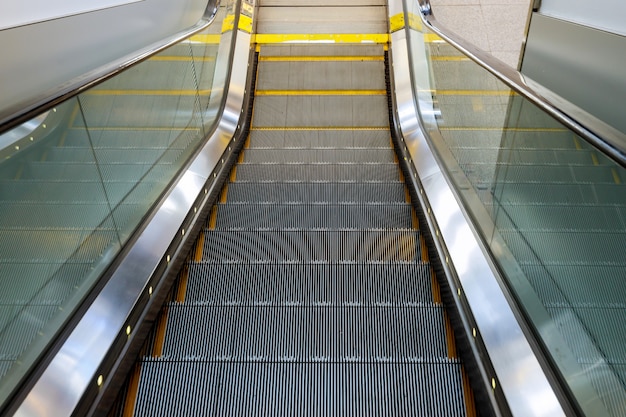 Interior design empty escalator stairs in the airport