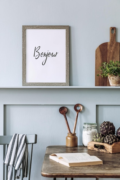 interior design of kitchen space with mock up photo frame wooden table herbs vegetables fruits food and kitchen accessories in modern home decor