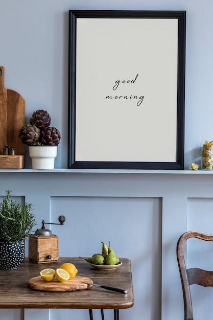 Photo interior design of kitchen space with  photo frame, wooden table, herbs, vegetables, fruits, food and kitchen accessories in modern home decor.