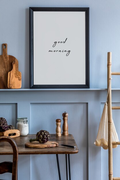 Photo interior design of kitchen space with photo frame, wooden table, herbs, vegetables, fruits, food and kitchen accessories in modern home decor.