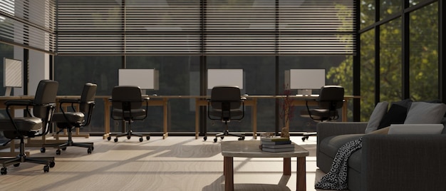 Interior design of a modern contemporary office with computer desks against the large glass wall