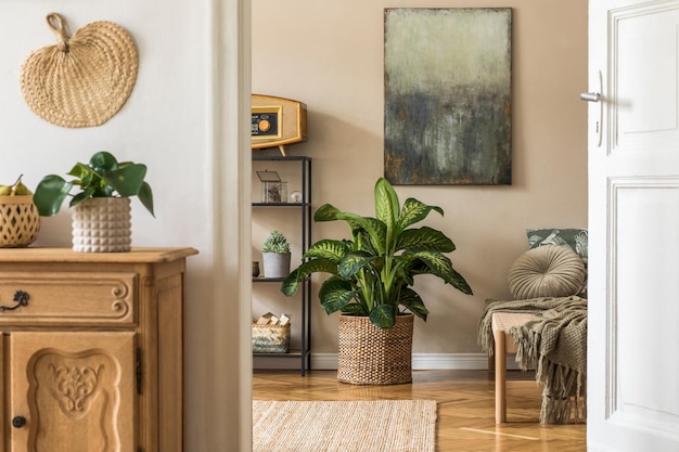 Interior design of oriental style living room with modern chaise longue, shelf, pillow, plaid,plants, elegant personal accessories and mock up paintings on the beige wall.