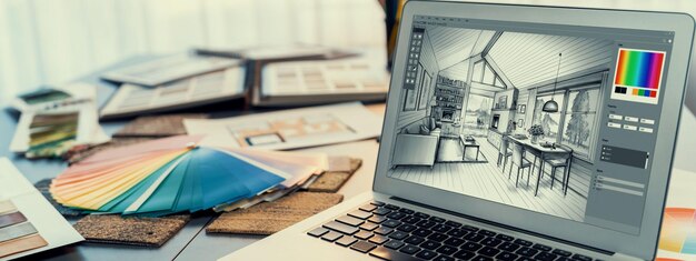 Foto tavolo per l'area di lavoro dell'interior designer e software di architettura sullo schermo del laptop con materiali per mood board e campioni di colori colorati per la selezione del colore ufficio di interior design moderno insight