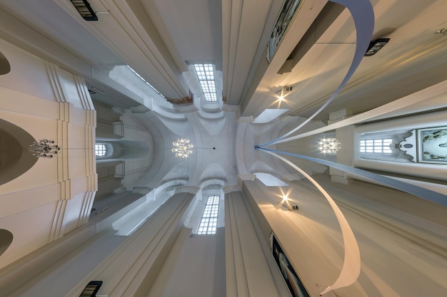 Interior dome and looking up into a old gothic or baroque\
catholic church ceiling with columns