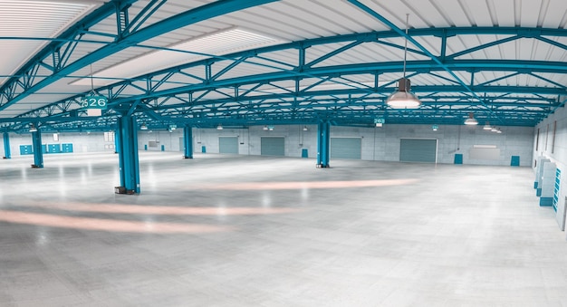 Interior of an empty modern warehouse with blue structures